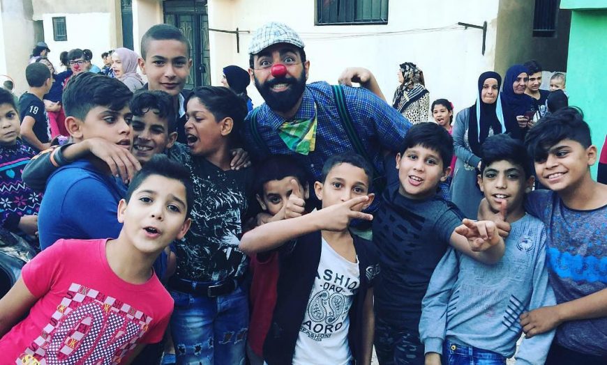 Group of boys with clown posing at school