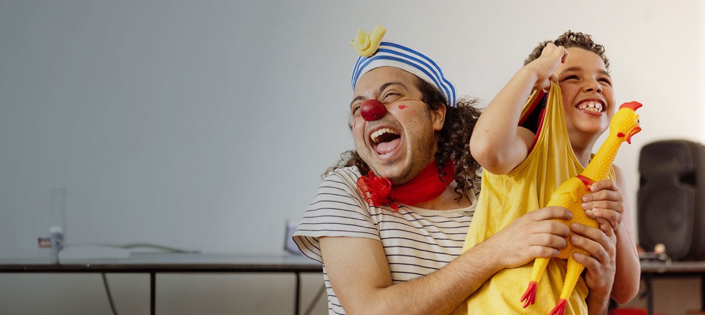 CWB USA clown with kid and rubber chicken