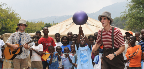 Kid on stage balancing ball on finger